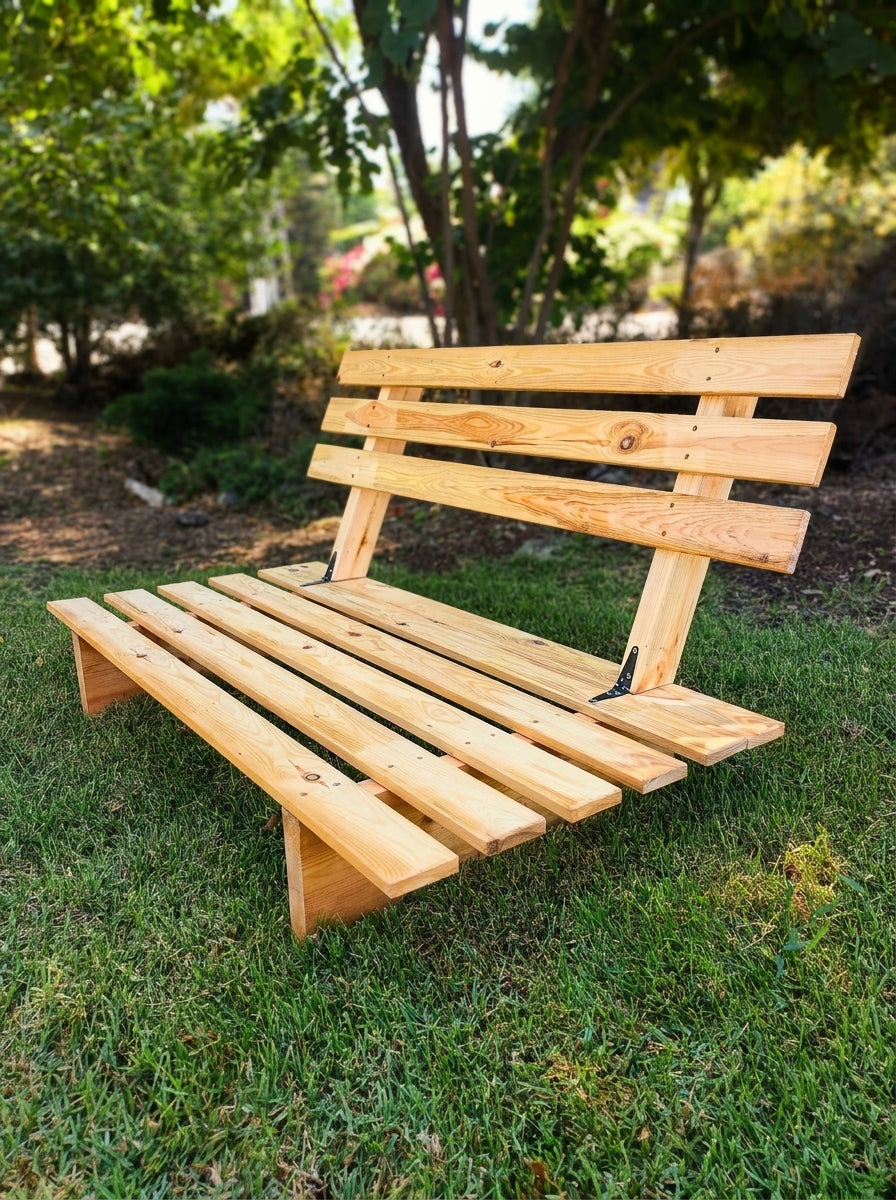 A raw pine Zoola bench resting before its oil coat, Western North Carolina workshop